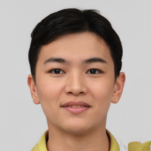 Joyful asian young-adult female with short  black hair and brown eyes