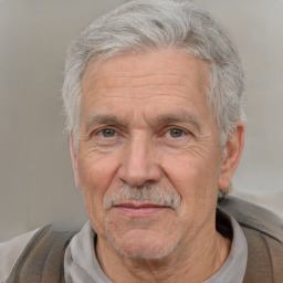 Neutral white middle-aged male with short  gray hair and brown eyes