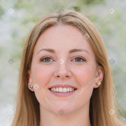 Joyful white young-adult female with long  brown hair and blue eyes