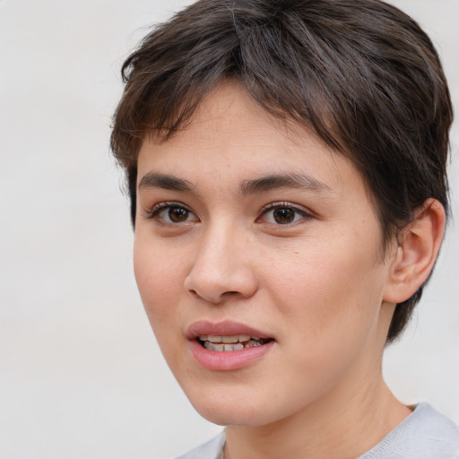 Joyful white young-adult female with short  brown hair and brown eyes
