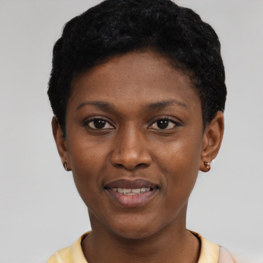 Joyful black young-adult female with short  black hair and brown eyes