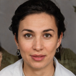 Joyful white adult female with short  brown hair and brown eyes