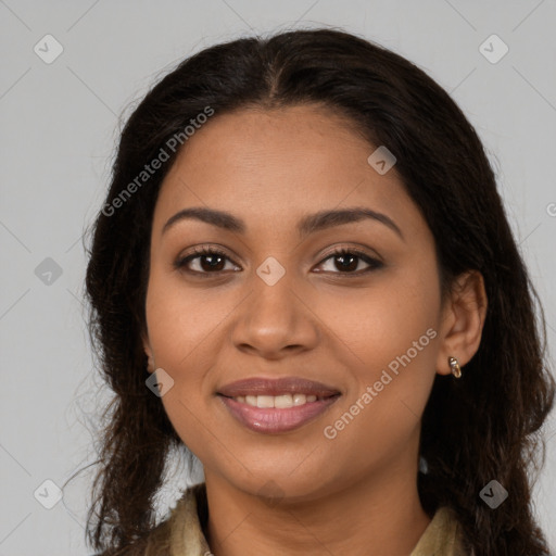 Joyful latino young-adult female with long  brown hair and brown eyes