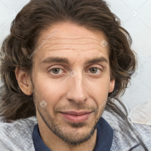 Joyful white adult male with medium  brown hair and brown eyes