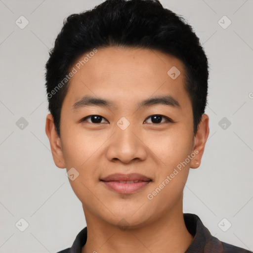 Joyful asian young-adult male with short  black hair and brown eyes