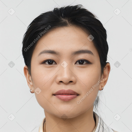 Joyful asian young-adult female with medium  black hair and brown eyes