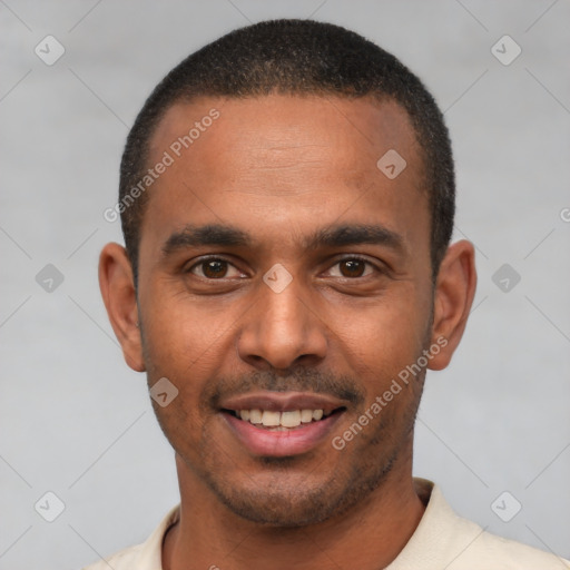 Joyful latino young-adult male with short  brown hair and brown eyes