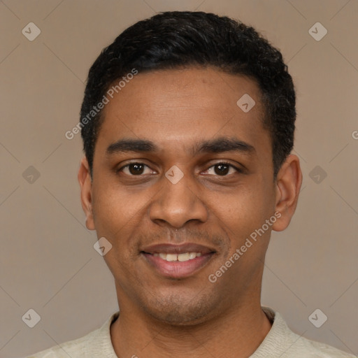 Joyful black young-adult male with short  black hair and brown eyes