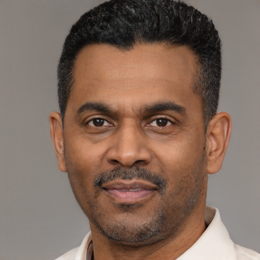 Neutral latino adult male with short  black hair and brown eyes