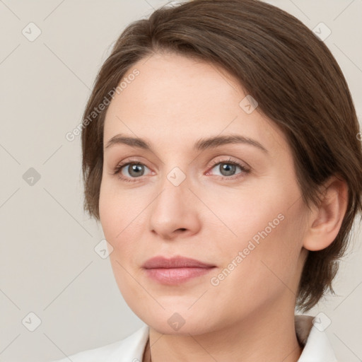 Joyful white young-adult female with medium  brown hair and green eyes