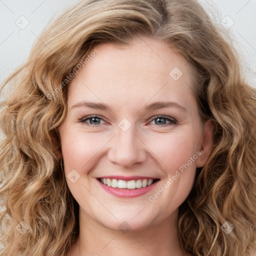 Joyful white young-adult female with long  brown hair and blue eyes