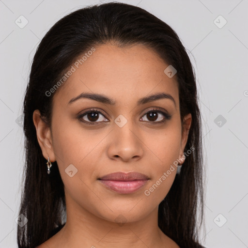 Joyful latino young-adult female with long  brown hair and brown eyes