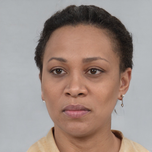 Neutral latino adult female with short  brown hair and brown eyes