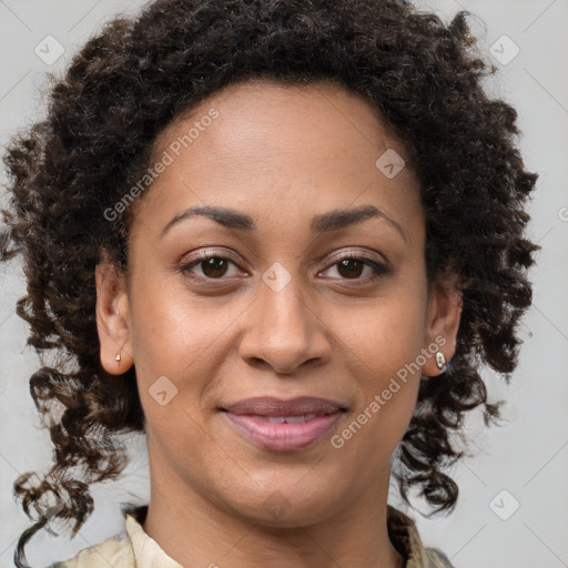 Joyful black young-adult female with medium  brown hair and brown eyes