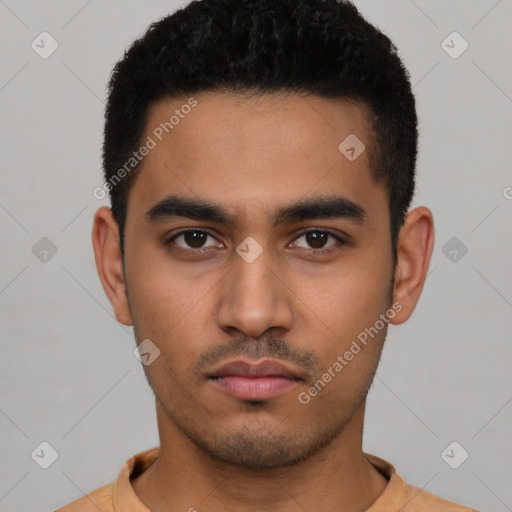 Neutral latino young-adult male with short  black hair and brown eyes