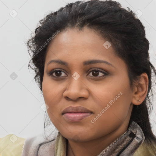 Joyful black young-adult female with long  brown hair and brown eyes