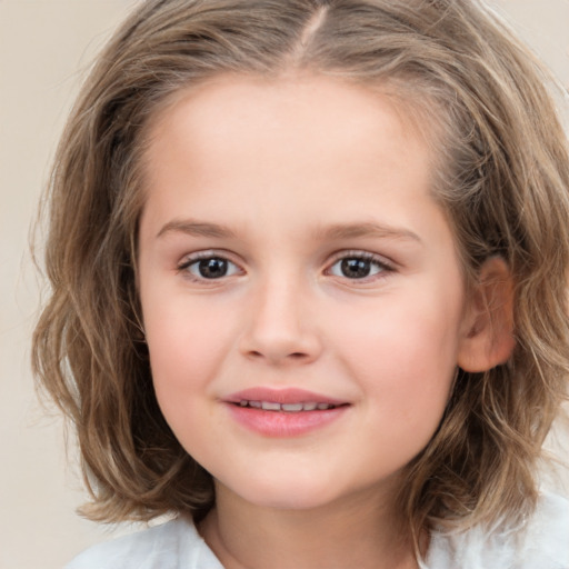 Joyful white child female with medium  brown hair and brown eyes