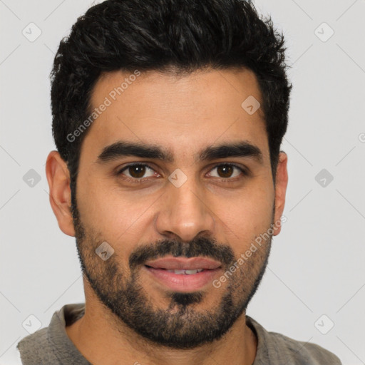 Joyful latino young-adult male with short  black hair and brown eyes