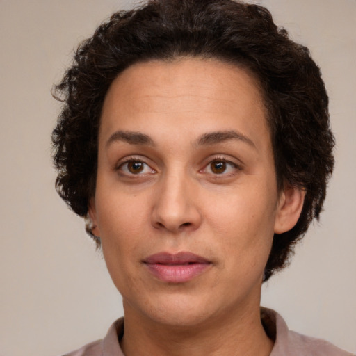 Joyful white adult female with short  brown hair and brown eyes