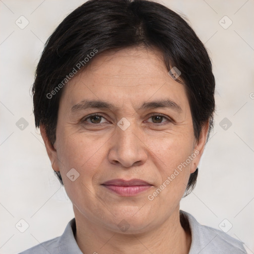 Joyful white adult female with short  brown hair and brown eyes