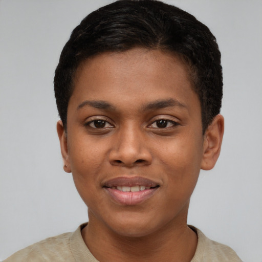 Joyful black young-adult female with short  brown hair and brown eyes