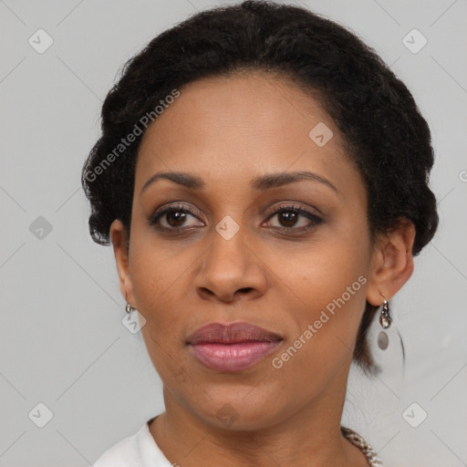 Joyful black adult female with short  brown hair and brown eyes