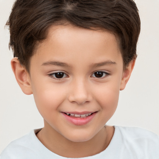 Joyful white child female with short  brown hair and brown eyes