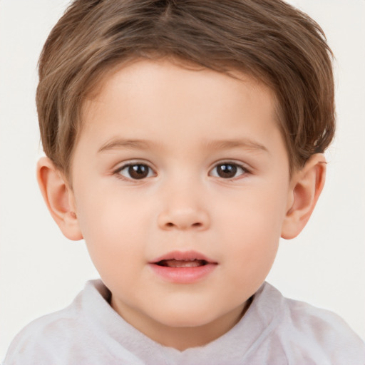 Joyful white child male with short  brown hair and brown eyes