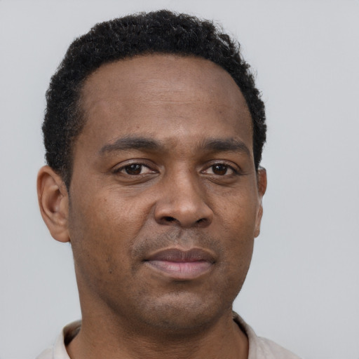 Neutral black young-adult male with short  brown hair and brown eyes