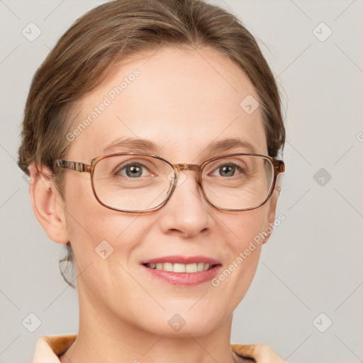 Joyful white adult female with short  brown hair and grey eyes