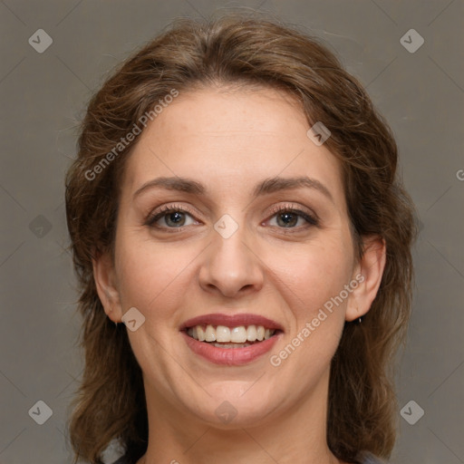 Joyful white young-adult female with medium  brown hair and grey eyes