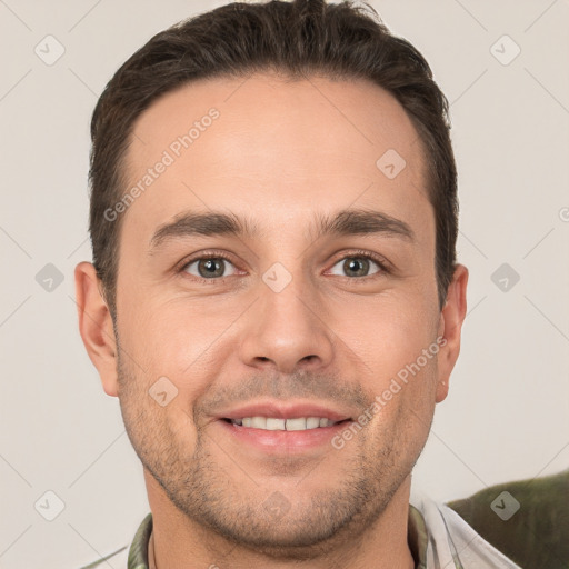 Joyful white young-adult male with short  brown hair and brown eyes