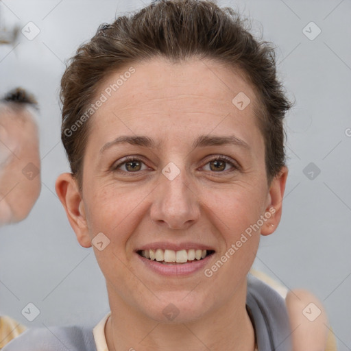 Joyful white adult female with short  brown hair and brown eyes