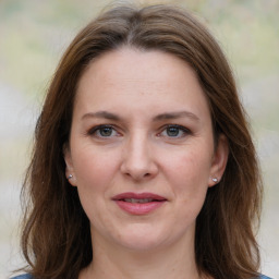 Joyful white adult female with medium  brown hair and grey eyes