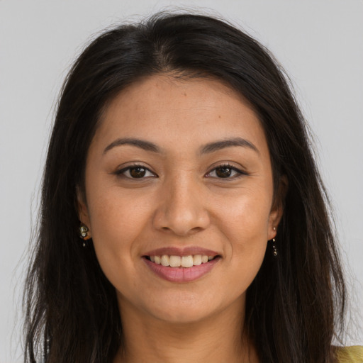 Joyful white young-adult female with long  brown hair and brown eyes