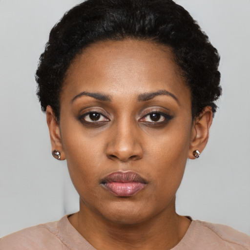 Neutral latino young-adult female with short  black hair and brown eyes