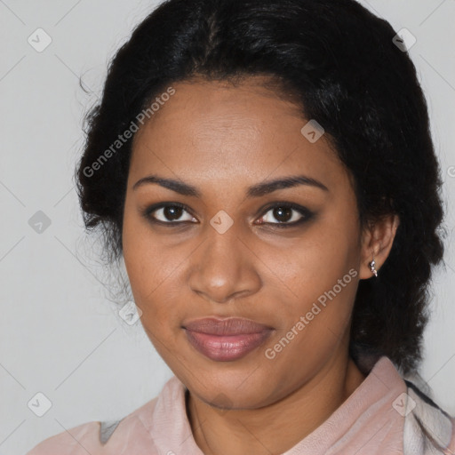 Joyful black young-adult female with long  black hair and brown eyes