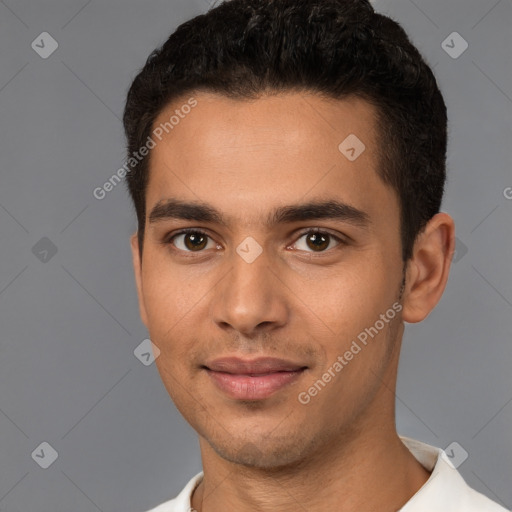 Joyful white young-adult male with short  black hair and brown eyes