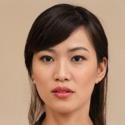 Neutral asian young-adult female with medium  brown hair and brown eyes