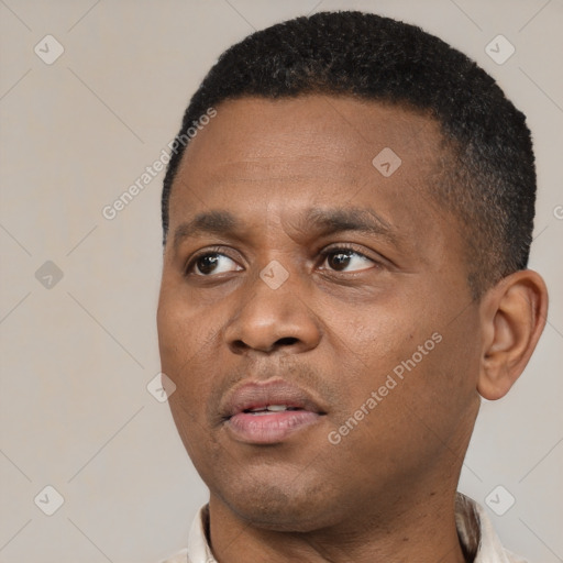 Neutral black young-adult male with short  black hair and brown eyes