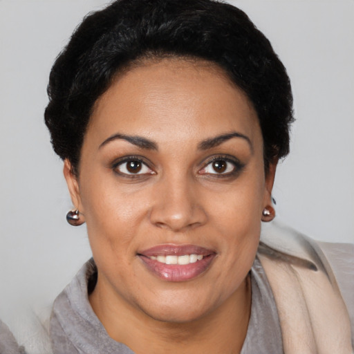 Joyful latino young-adult female with short  brown hair and brown eyes