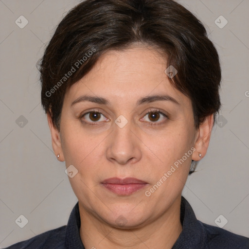 Joyful white adult female with medium  brown hair and brown eyes