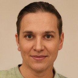 Joyful white adult male with short  brown hair and brown eyes