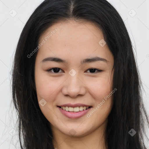 Joyful asian young-adult female with long  brown hair and brown eyes