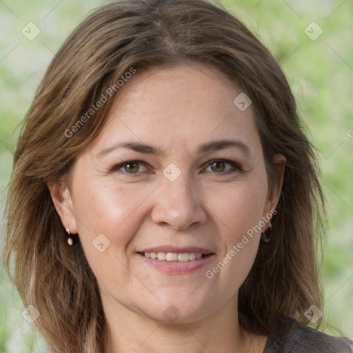 Joyful white adult female with medium  brown hair and grey eyes