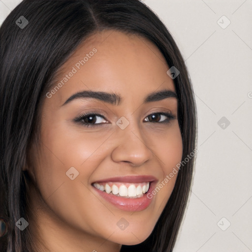 Joyful latino young-adult female with long  brown hair and brown eyes