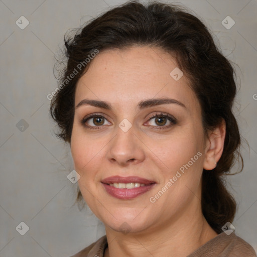 Joyful white adult female with medium  brown hair and brown eyes