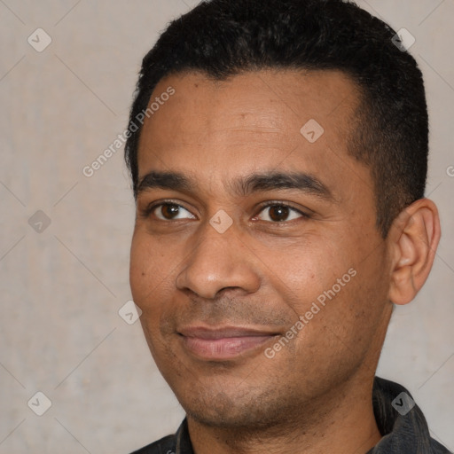 Joyful latino young-adult male with short  black hair and brown eyes