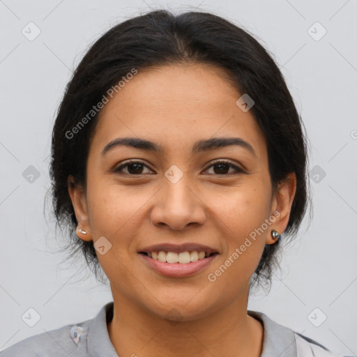 Joyful latino young-adult female with medium  brown hair and brown eyes