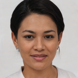 Joyful asian young-adult female with short  black hair and brown eyes